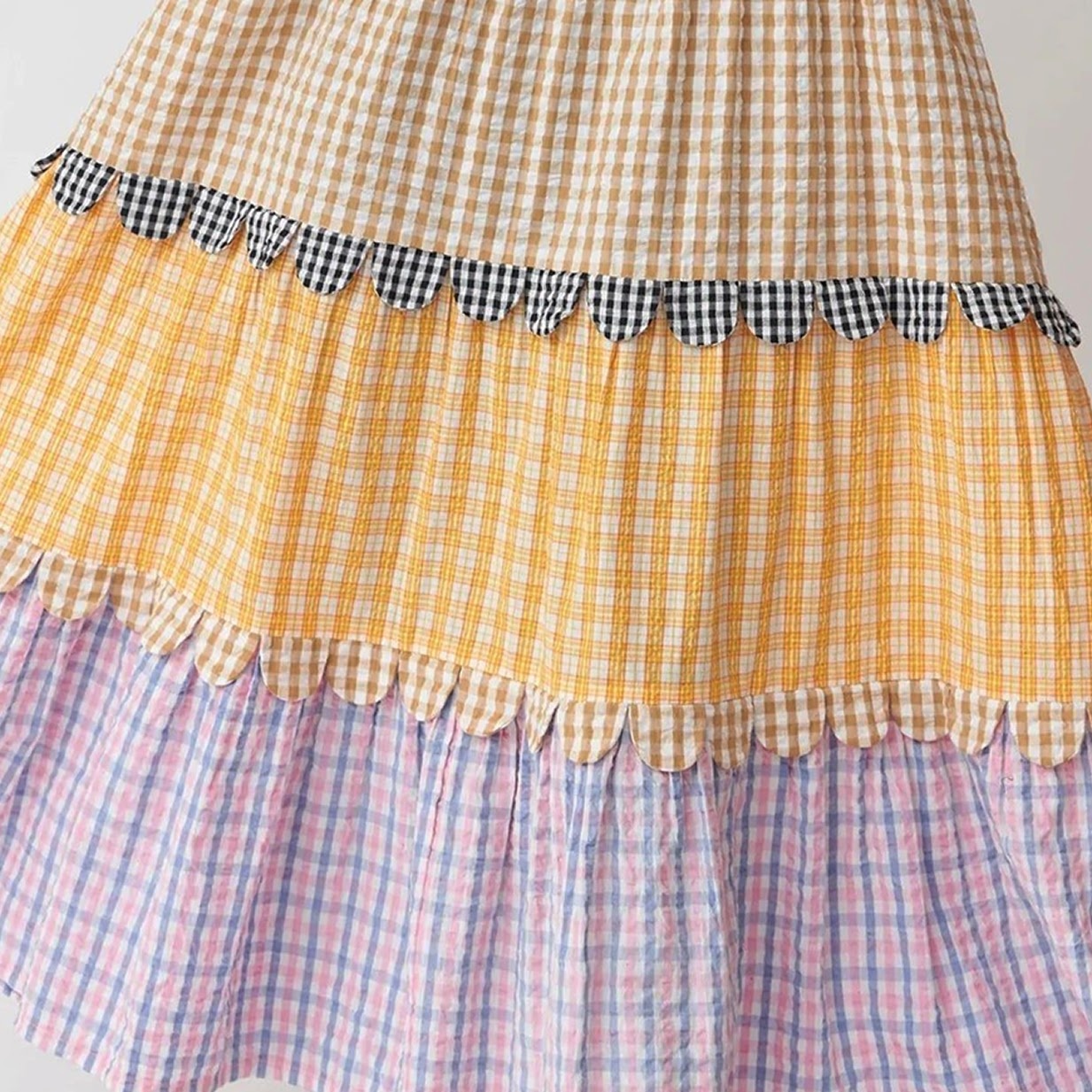Long skirt with scalloped edges on the layers.