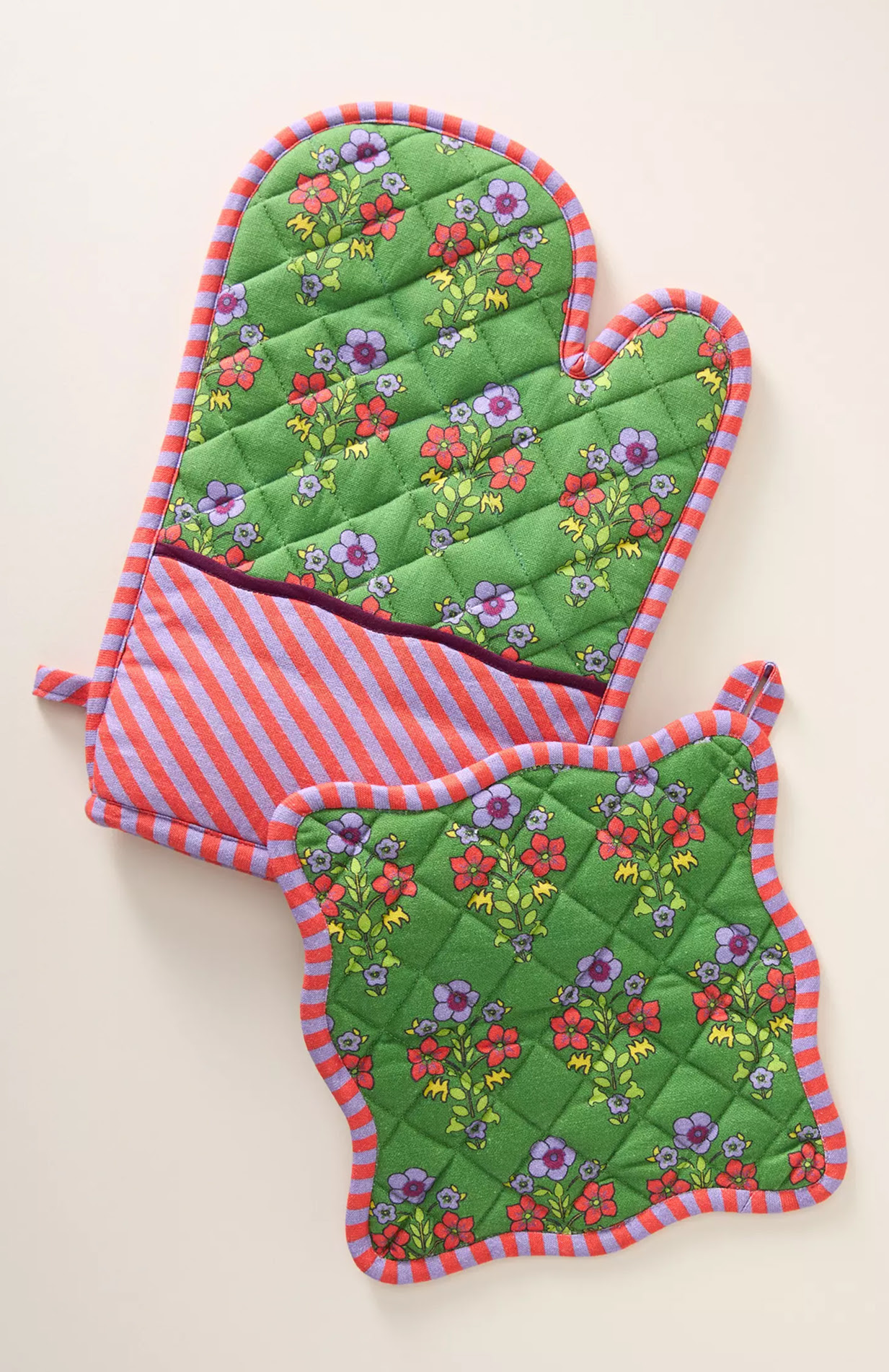 Potholder and oven mitt in green floral fabric.