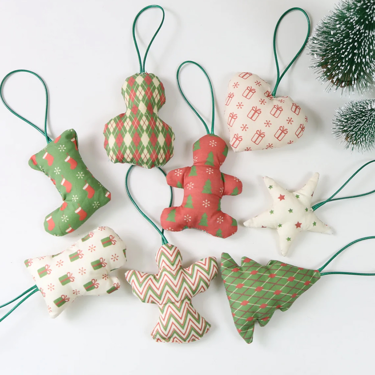 Top down view of sewn Christmas ornaments in fabrics with different prints.