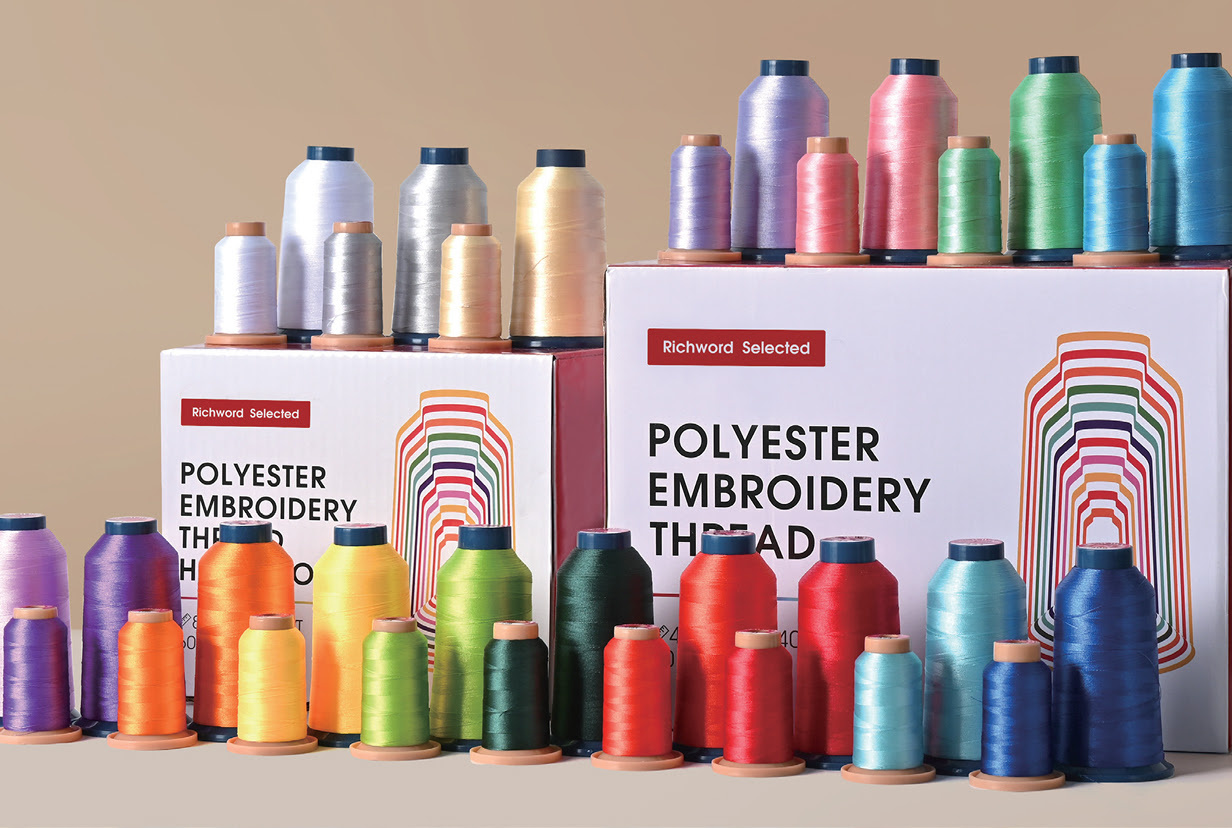 Cones of embroidery thread in a variety of colours.