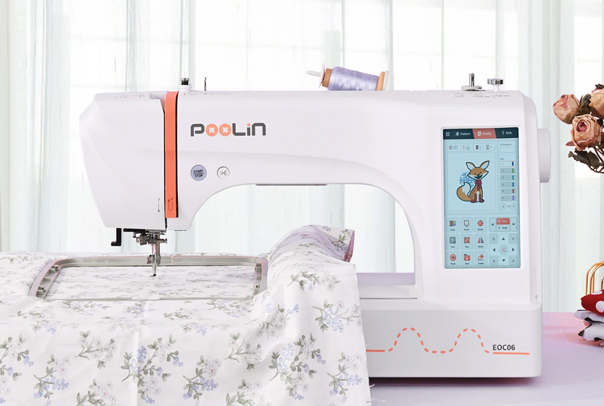 PooLin EOC06 with floral fabric in the embroidery hoop, ready for embroidering.