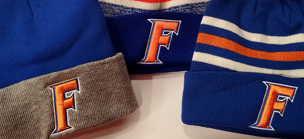 Embroidered blue beanies with an embroidered letter F in red.