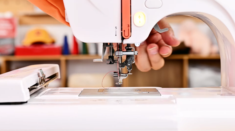 Raise the presser foot using the handle on your embroidery machine