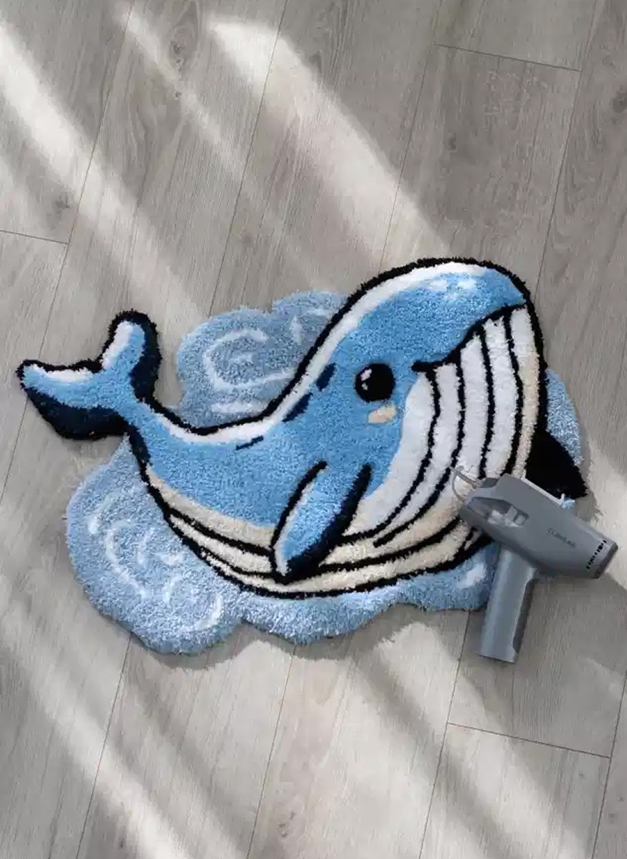 Tufted rug of a whale.
