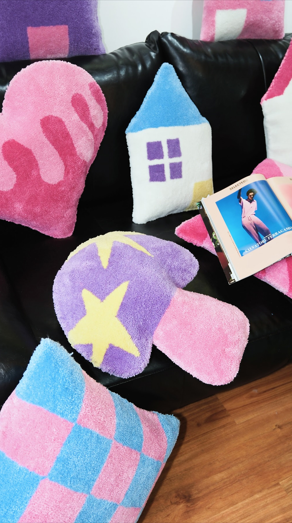 Tufted home décor in pink, blue, purple and white.