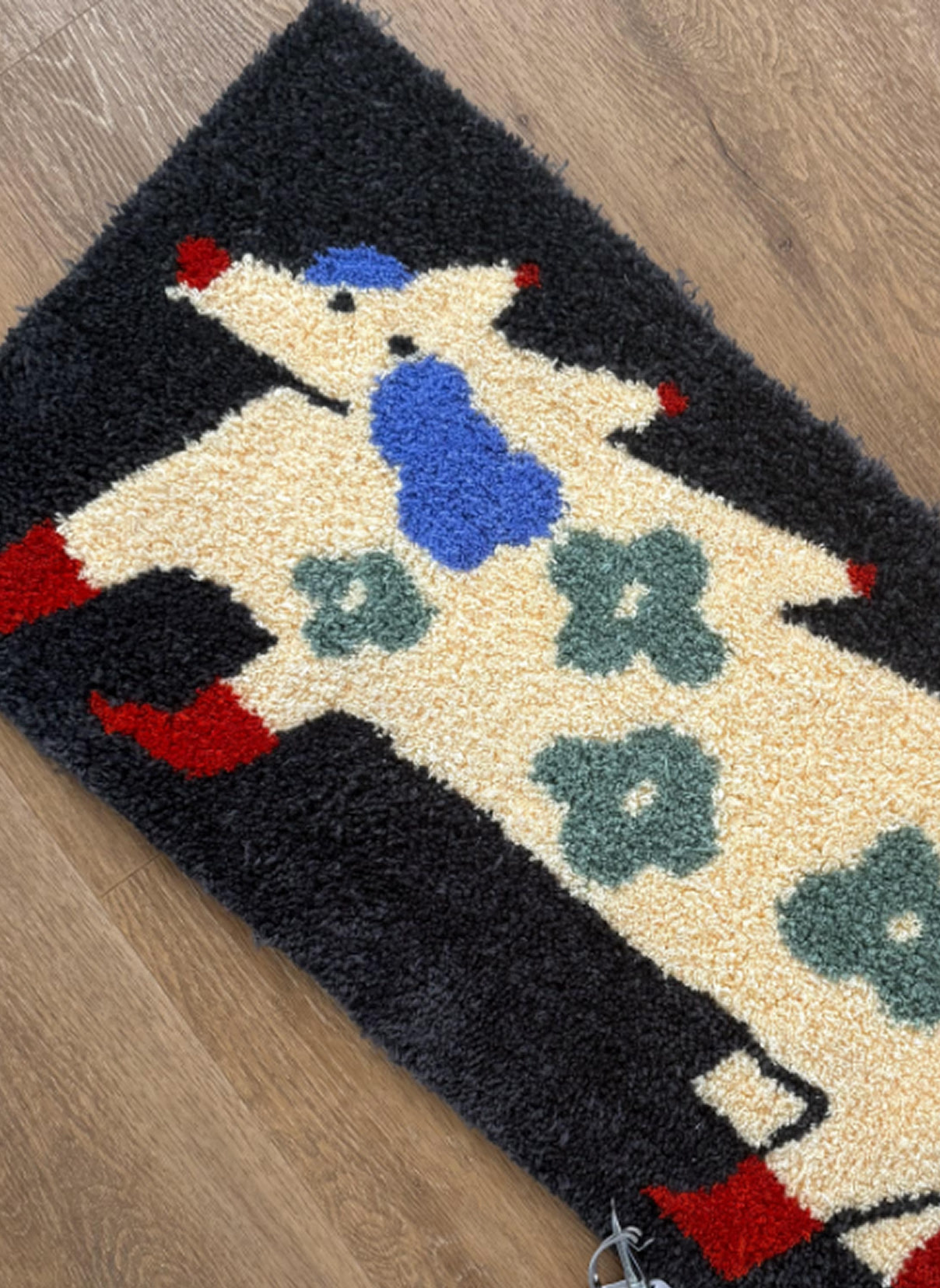 Tufted rug of a stylised rug.