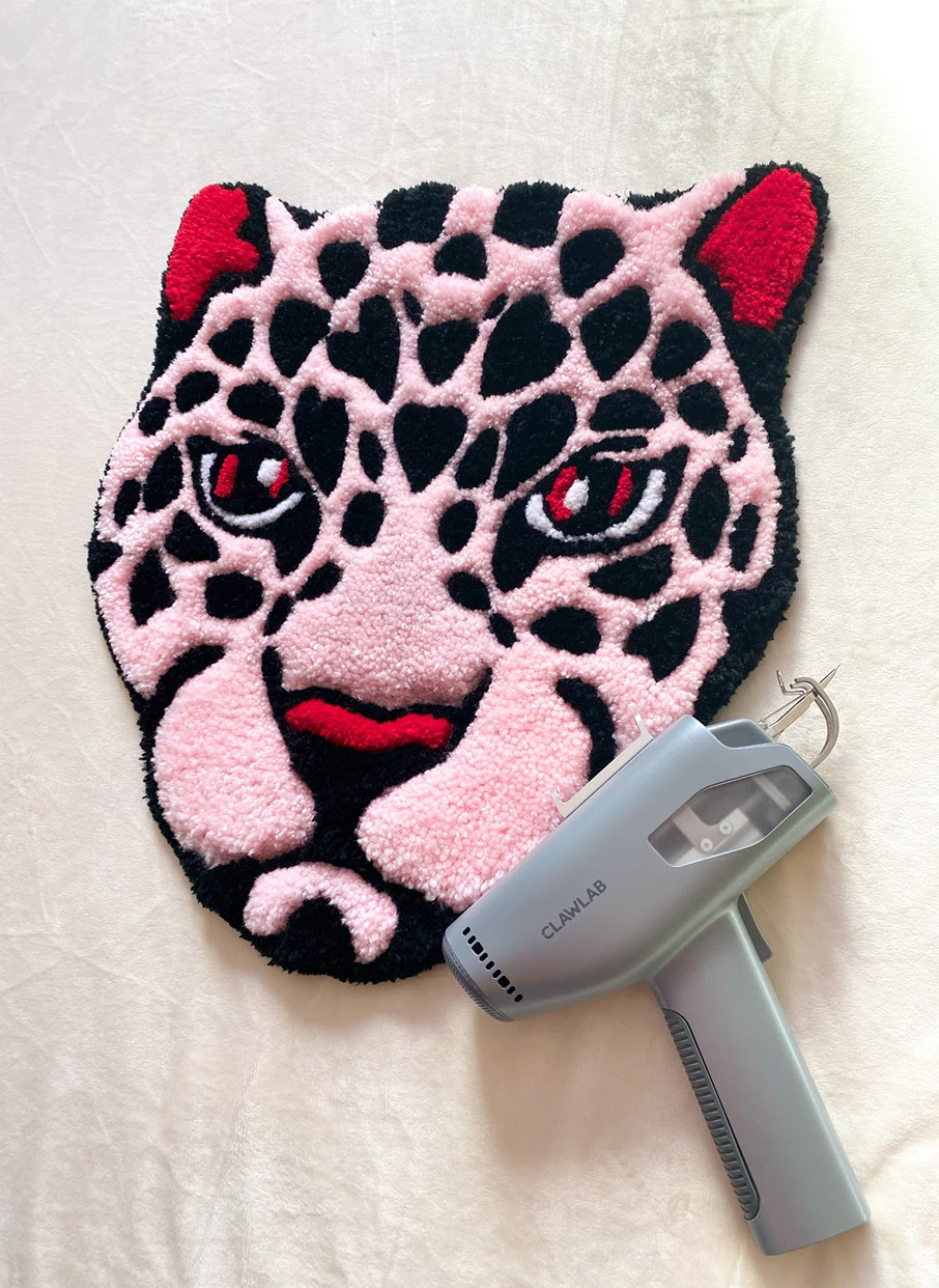 Tufted rug of a pink leopard.