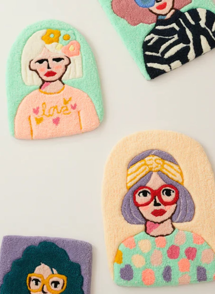Handcrafted tufted portrait rugs featuring colourful illustrated women.