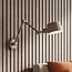 Wandlampe Mellow in Taupe mit verstellbarem Arm und beidseitigem Licht