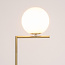 Lampadaire design Connor en doré et verre blanc laiteux