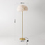 Lampadaire design Evania avec plumes blanches et pied en laiton doré