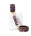 Neonrosa Handfesseln mit Reptilienprint aus veganem PVC-Leder