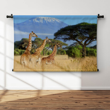 Drie giraffen bij de Kilimanjaro berg