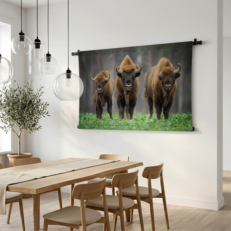 Drie bizons in het bos