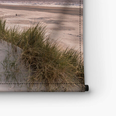 Uitzicht vanaf de duinen over het strand en de Noordzee
