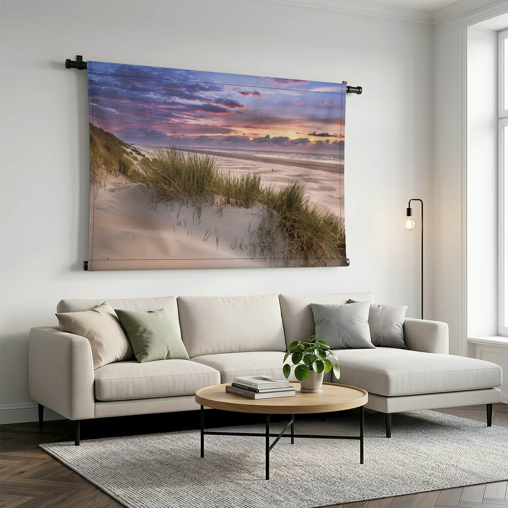 Uitzicht vanaf de duinen over het strand en de Noordzee