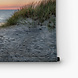 Zandduinen op het strand bij zonsondergang
