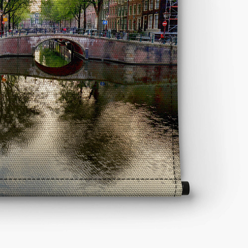 Amsterdamse grachtenpanden bij zonsondergang