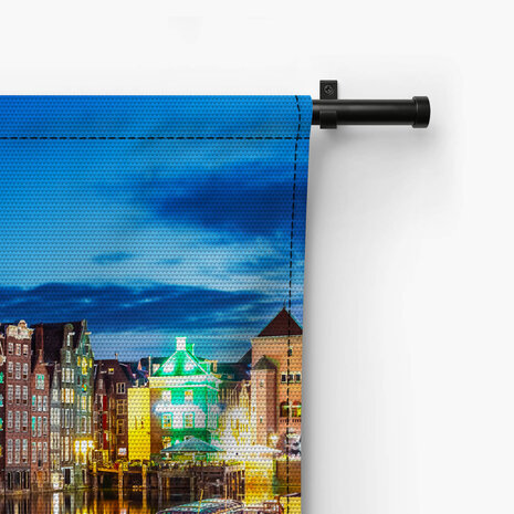 Zomeravond met uitzicht op iconische Amsterdamse gebouwen