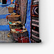 Straatje in Chefchaouen met kleden