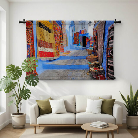 Straatje in Chefchaouen met kleden