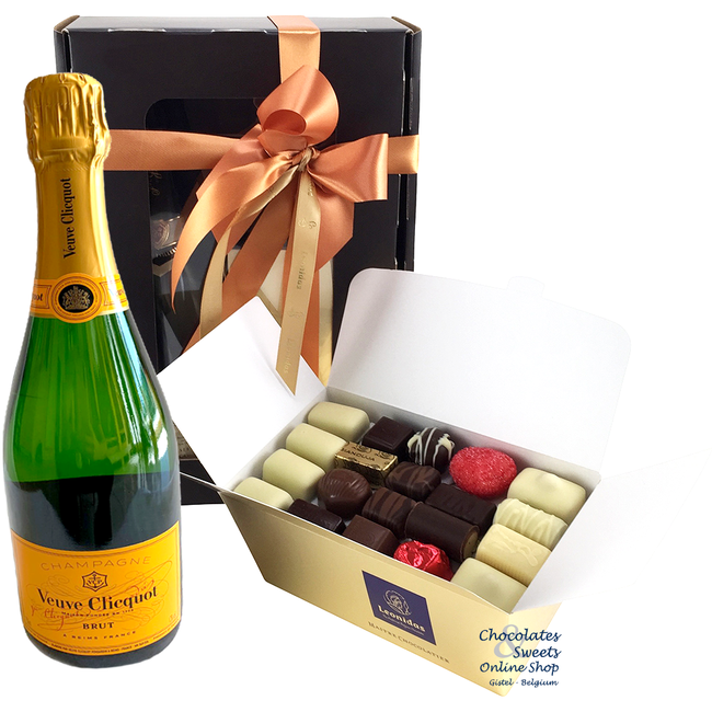 1kg Pralinen und eine Flasche Champagne Veuve Clicquot 75cl.