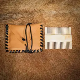 Medieval bone comb with leather bag