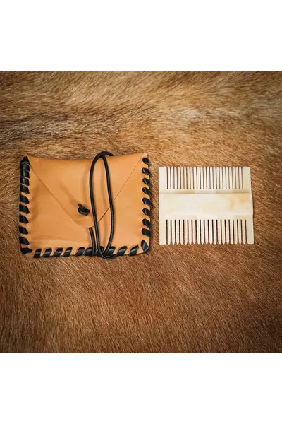Medieval bone comb with leather bag
