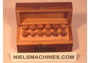 Sold: Assortment of bronze bushings and ruby jewels