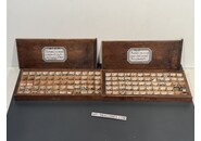 Sammlung von Uhrmacher Kronen in Holzkiste