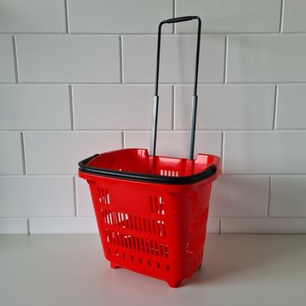 Winkelmand >Shop en Roll< op rubberen wielen rood Ral 3020 / pantone 1797C, met uitschuifbare handgreep van aluminium, hoogte 90cm.