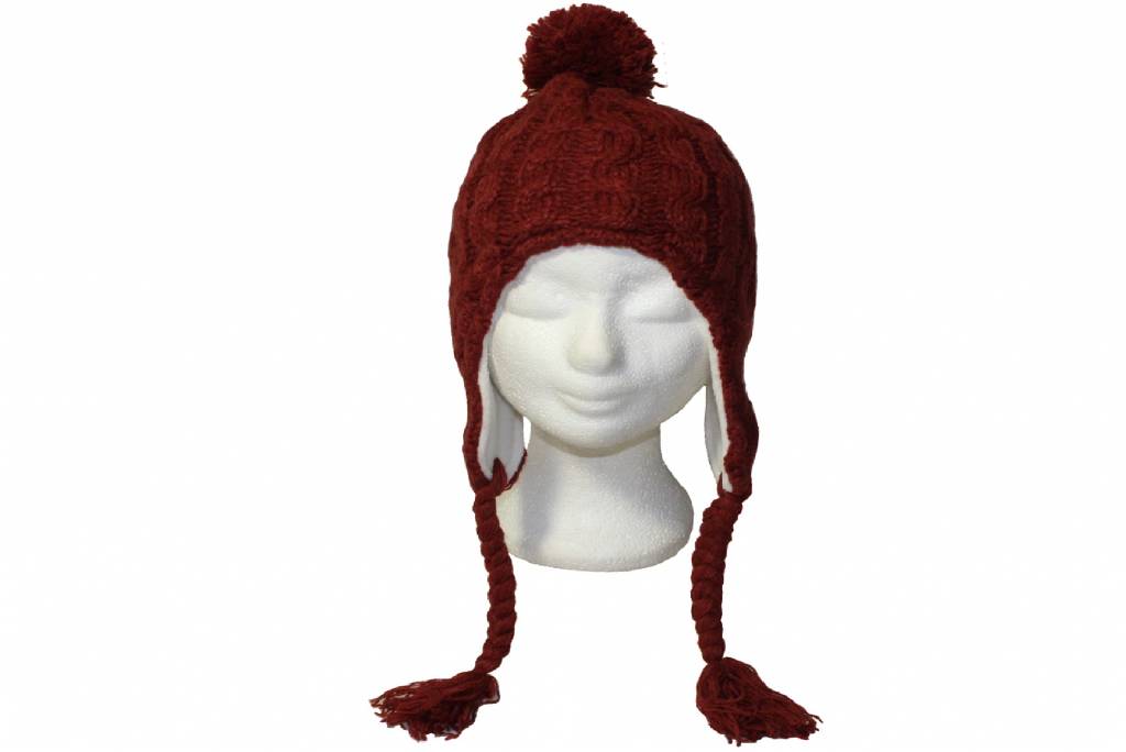 Gebreide pompon muts met vlechten roest oker Gebreide pompon muts met vlechten roest oker