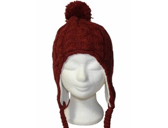 Gebreide pompon muts roest oker