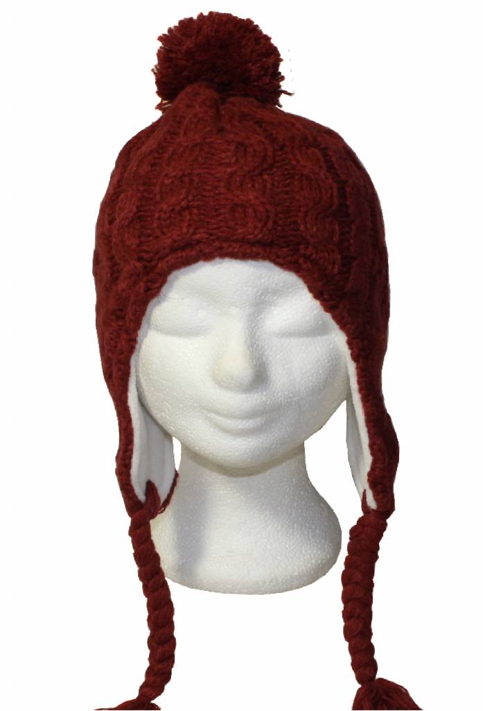 Gebreide pompon muts met vlechten roest oker Gebreide pompon muts met vlechten roest oker