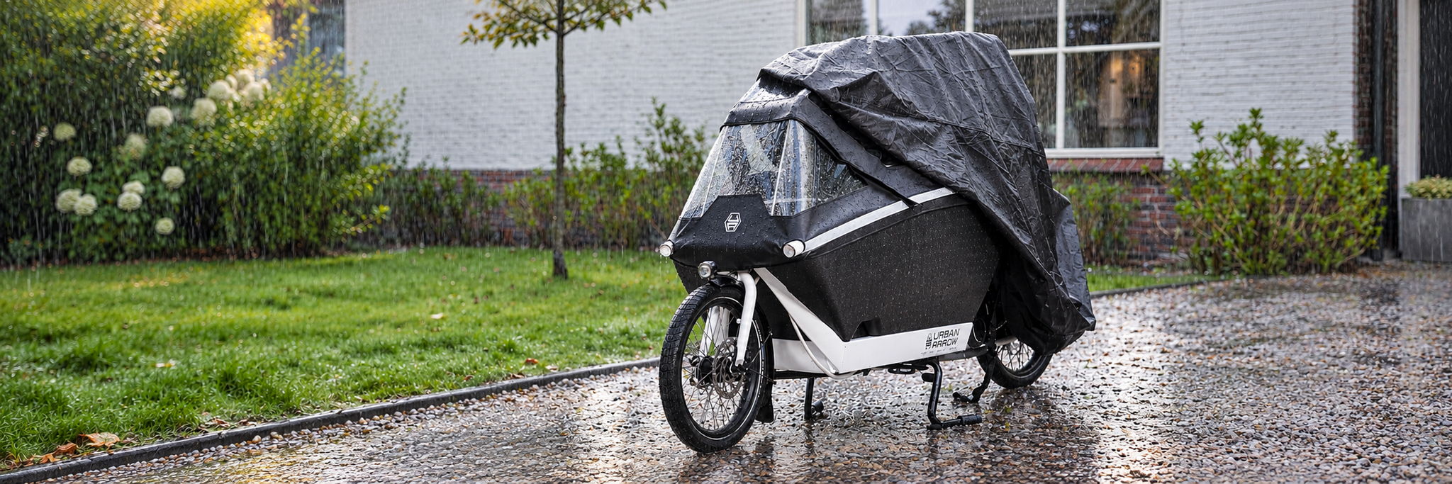Je bakfiets beschermen tegen de regen?