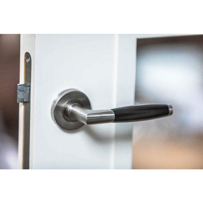 In-Door Copenhagen door handles made of solid stainless steel with black handle