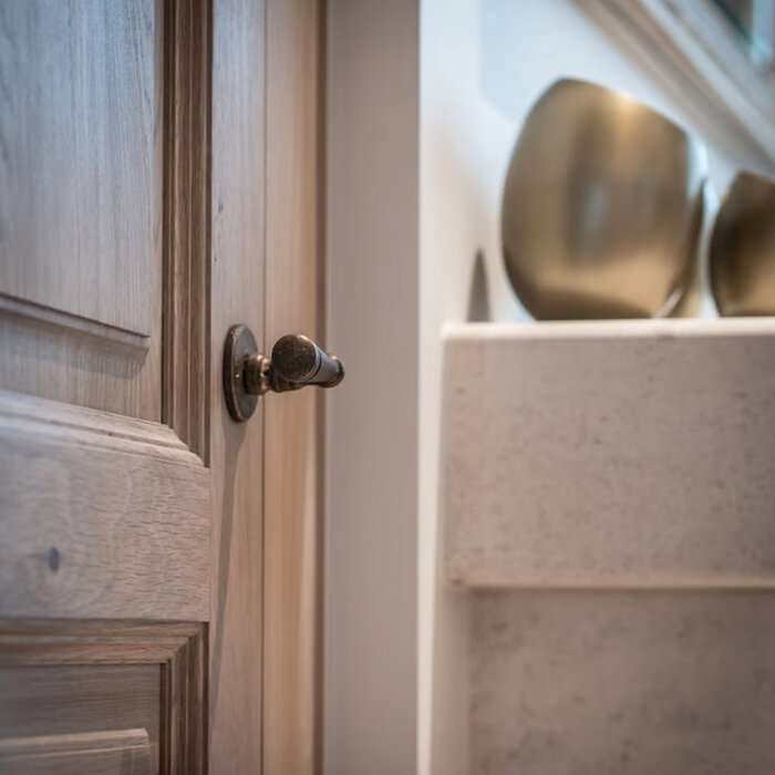 Dauby Dauby Pure door handle PH1830 / 50R on round rosette – raw bronze (RB)