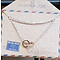 GO-DUTCH LABEL Go Dutch Label Edelstalen Ketting Kort Mini Cirkels Rosegoudkleurig