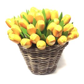 Yellow wooden tulips in a wicker basket