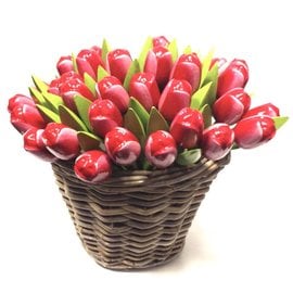 Red - white wooden tulips in a wicker basket