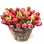 Wooden tulips in a wicker basket in mixed colors of red