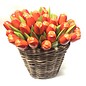 Orange wooden tulips in a wicker basket