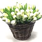 white wooden tulips in a wicker basket