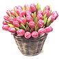 pink - white wooden tulips in a wicker basket