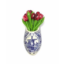 Wooden tulips in mixed colors of red in a Delft blue clog