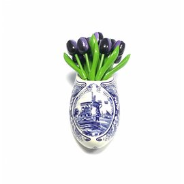 Dark purple wooden tulips in a Delft blue clog