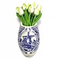 White wooden tulips in a Delft blue clog