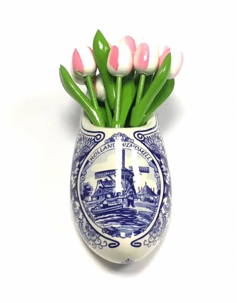 small wooden tulips in white rose in a delft blue