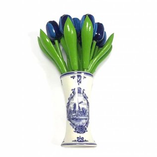small wooden tulips in blue in a Delft blue vase