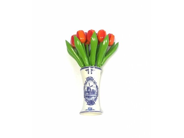 small wooden tulips in orange in a Delft blue vase